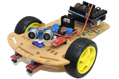 Junior students wiring and programming an Arduino-based robot