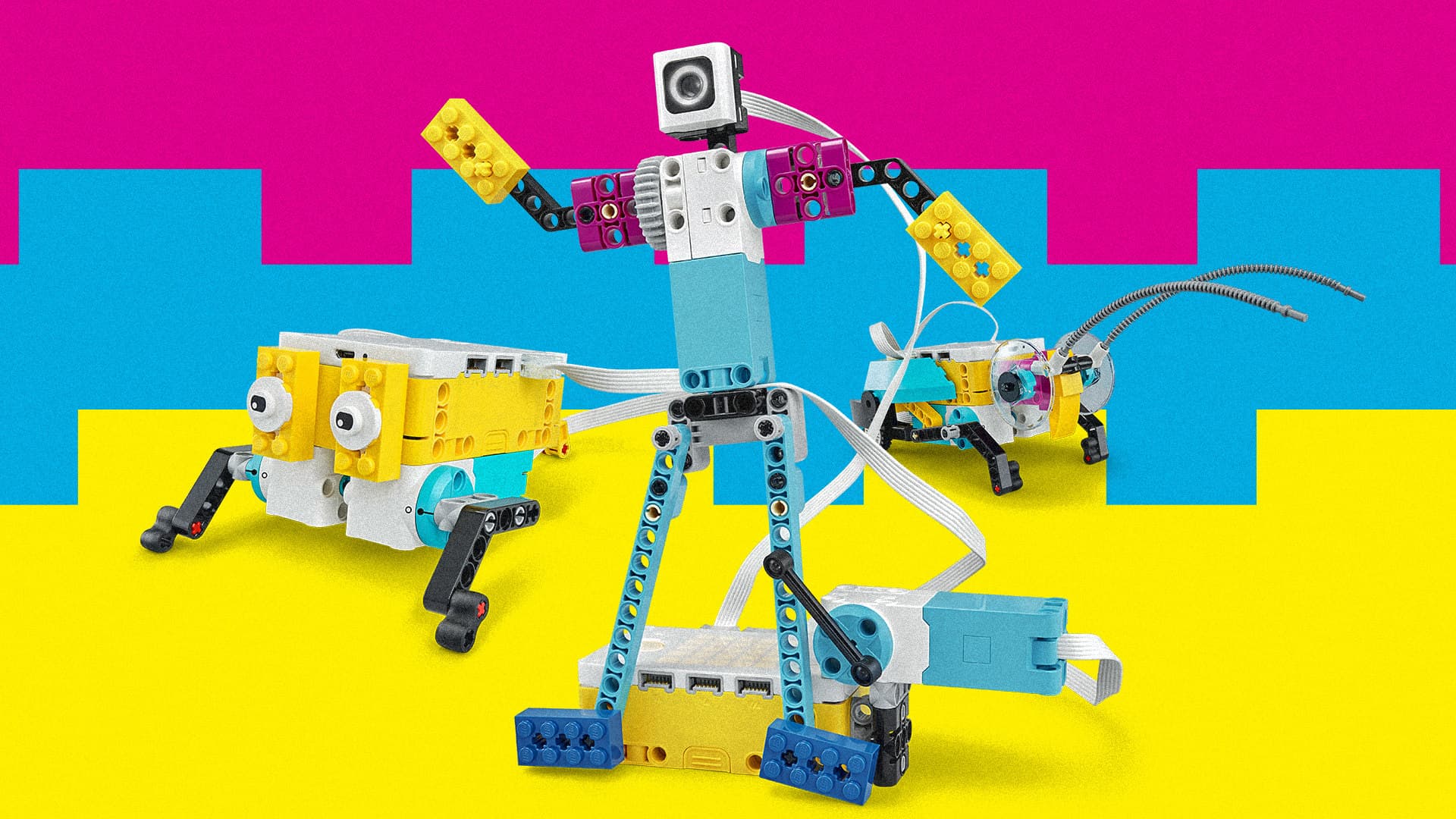 Elementary students building with a LEGO SPIKE robotics kit